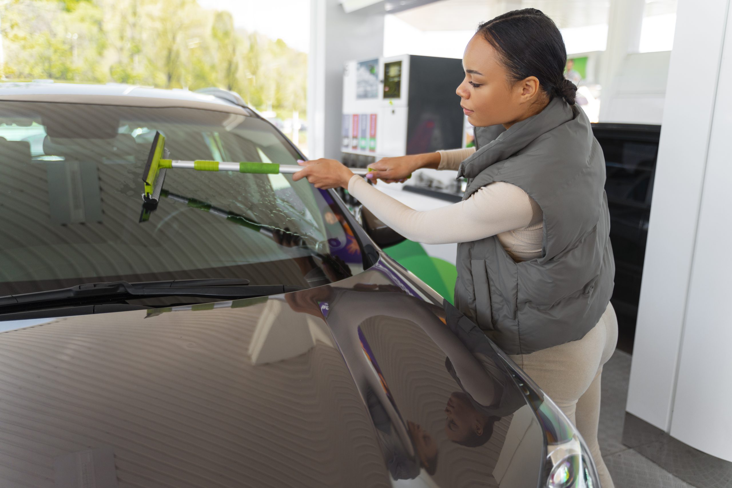 Person noticing a windshield chip — mobile chip repair available across Central Florida from Proset Auto Glass