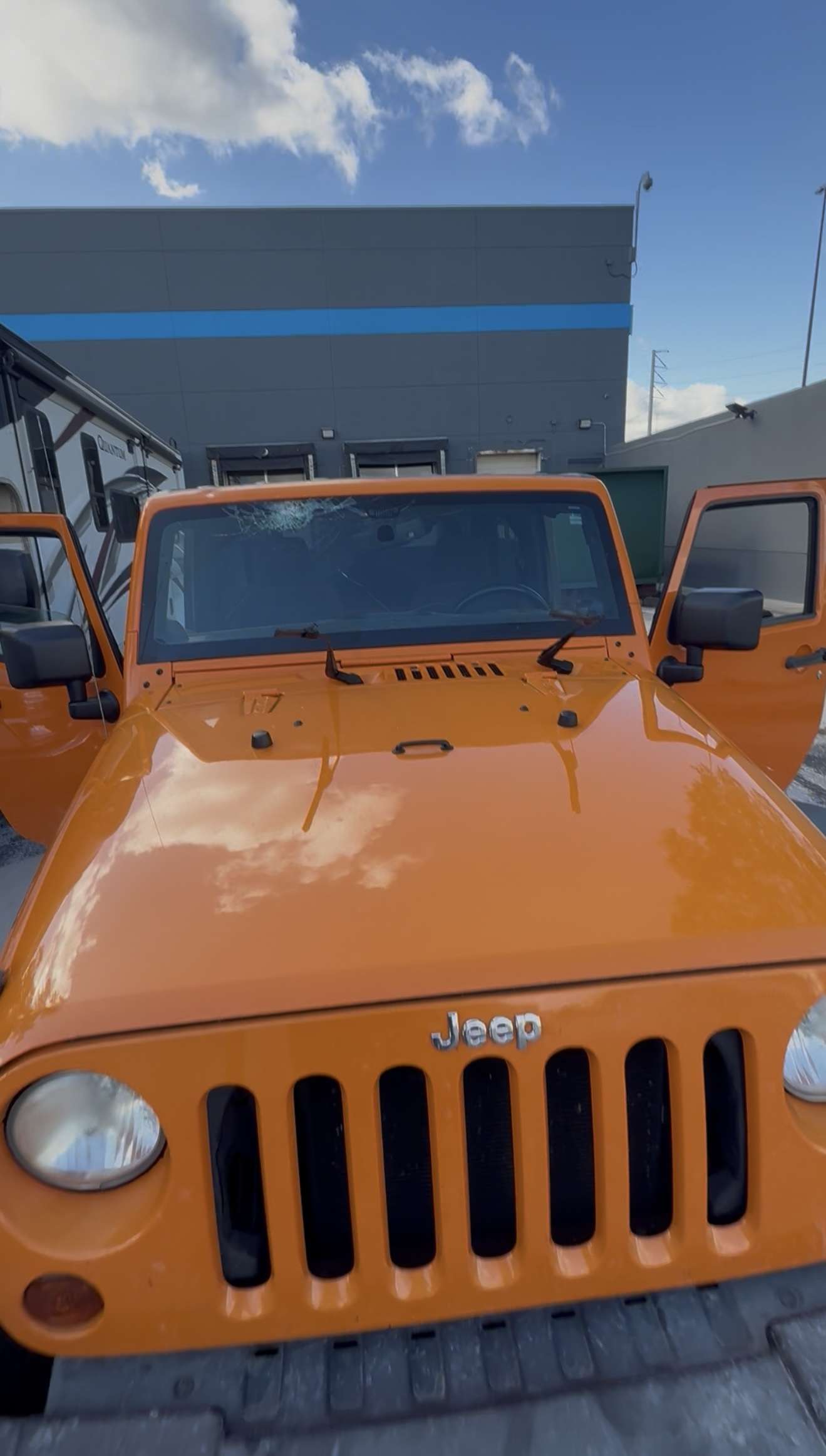 Cracked Jeep Wrangler windshield before replacement in Central Florida