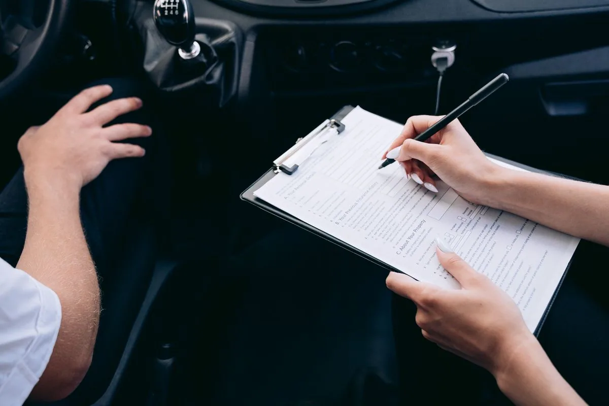 Customer reviewing auto glass insurance claim paperwork handled by Proset Auto Glass