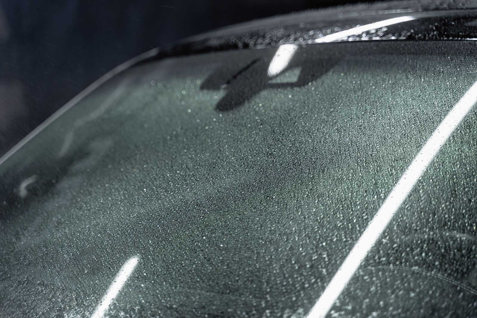 Close-up detail of a clean automotive windshield glass surface