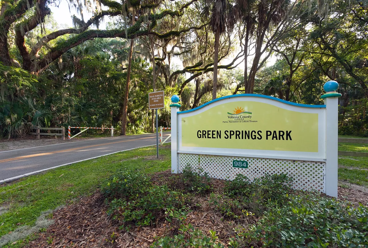 Green Springs Park entrance sign under live oaks near Deltona, FL