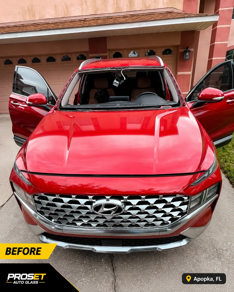 Before windshield replacement on a red Hyundai SUV in Apopka FL by Proset Auto Glass